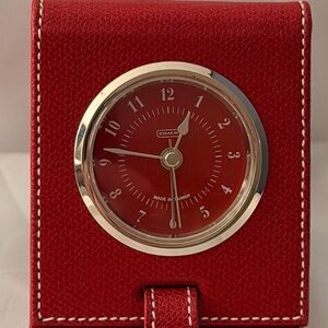 NWOT Vintage Coach travel alarm clock in a red leather folding case
